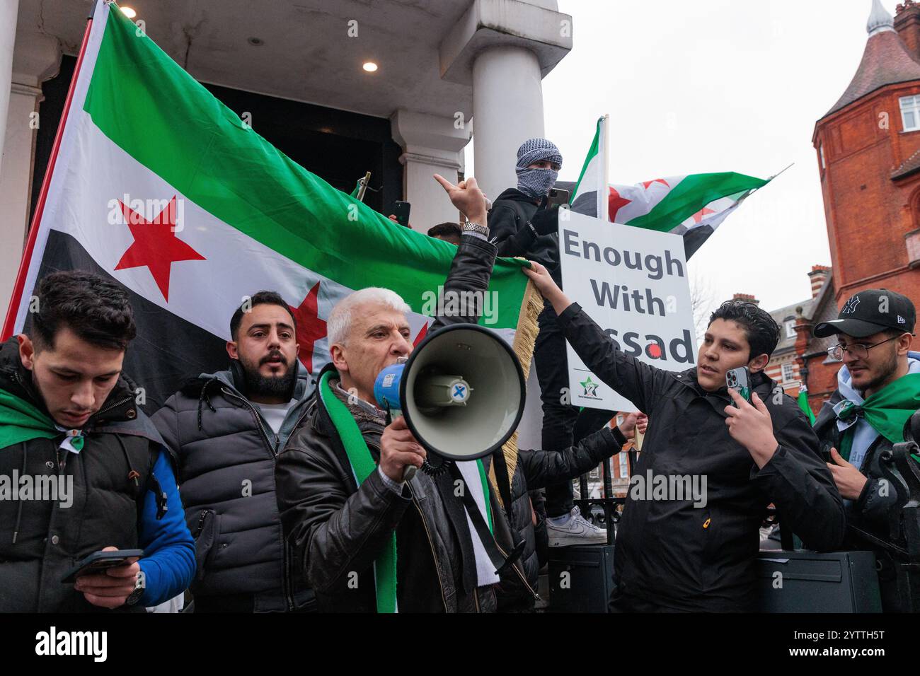 London, UK. 7th December, 2024. Jubilant Syrians attending a protest outside the Russian embassy against the Russian bombing of Idlib celebrate the latest rapid advances in Syria made by opposition groups. According to reports today, Syrian opposition fighters are taking the city of Homs and advancing on Damascus. The protest was organised by Syria Solidarity Campaign. Credit: Mark Kerrison/Alamy Live News Stock Photo