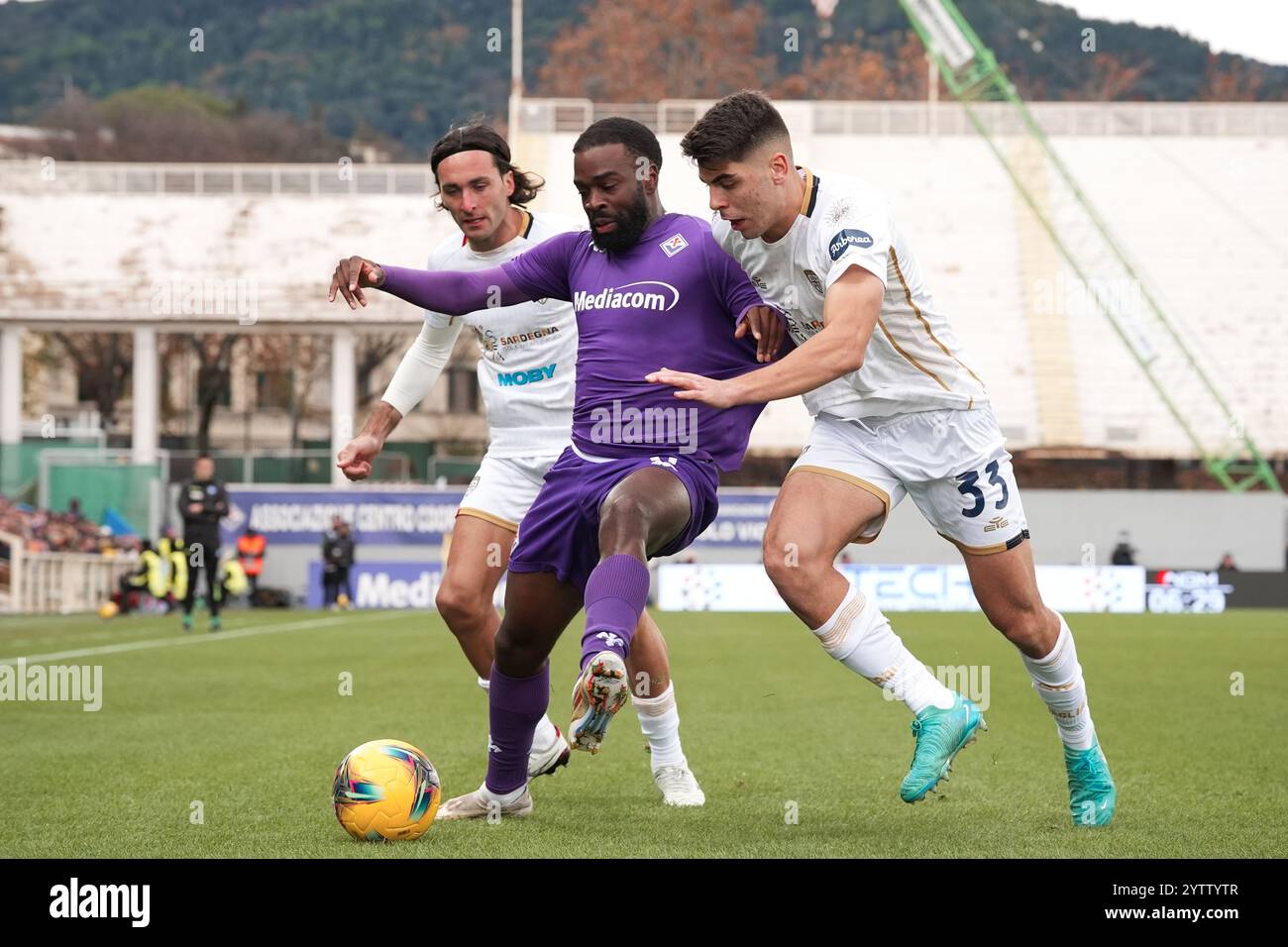 Firenze, Italia. 08th Dec, 2024. Fiorentina's Jonathan Ikone fights for the ball with Cagliari's Adam Obert and Cagliari's Sebastiano Luperto during the Serie A Enilive 2024/2025 match between Fiorentina and Cagliari - Serie A Enilive at Artemio Franchi Stadium - Sport, Soccer - Florence, Italy - Sunday December 6, 2024 (Photo by Massimo Paolone/LaPresse) Credit: LaPresse/Alamy Live News Stock Photo