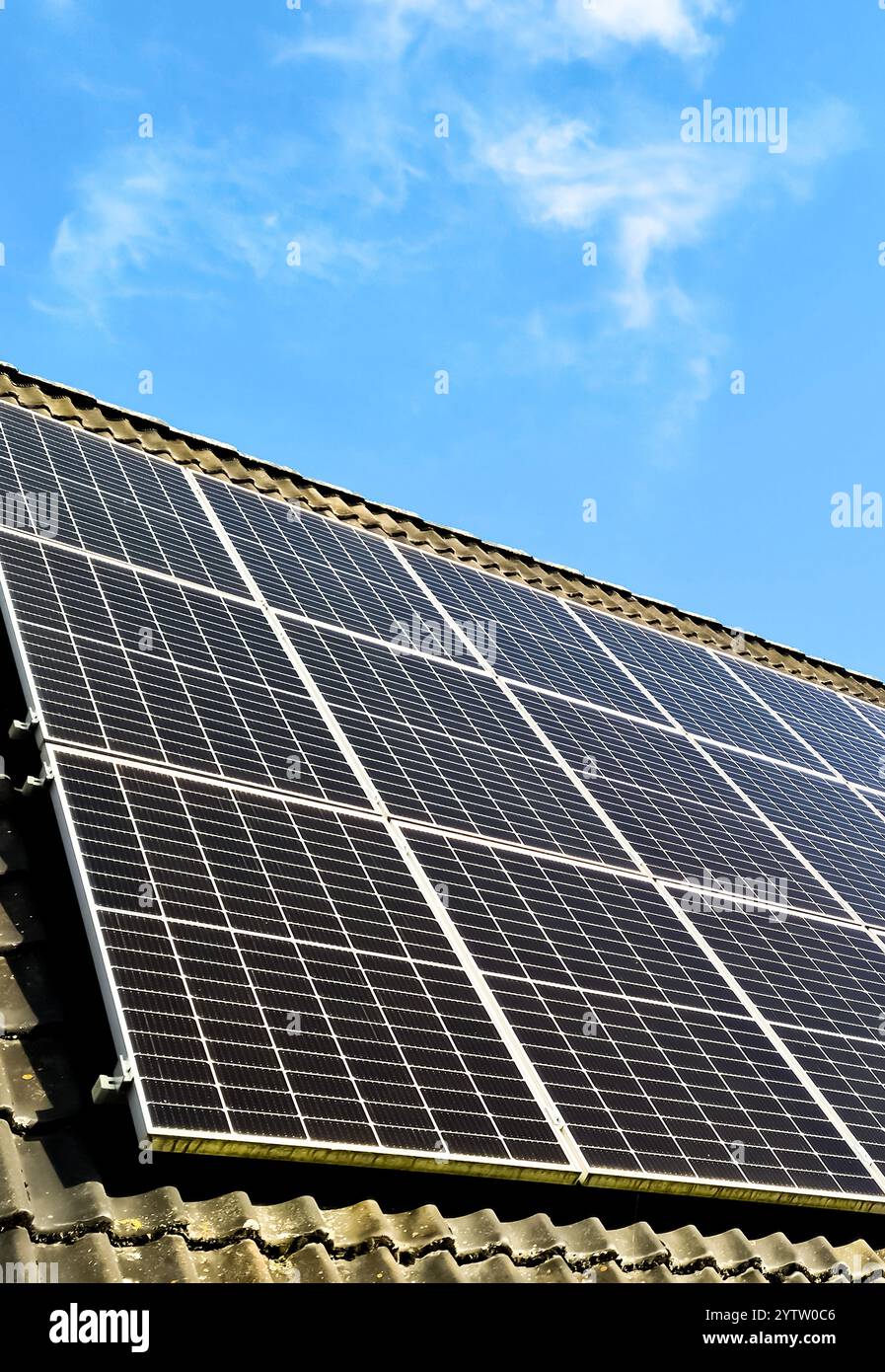 Solar panels producing clean energy on a roof of a residential house ...