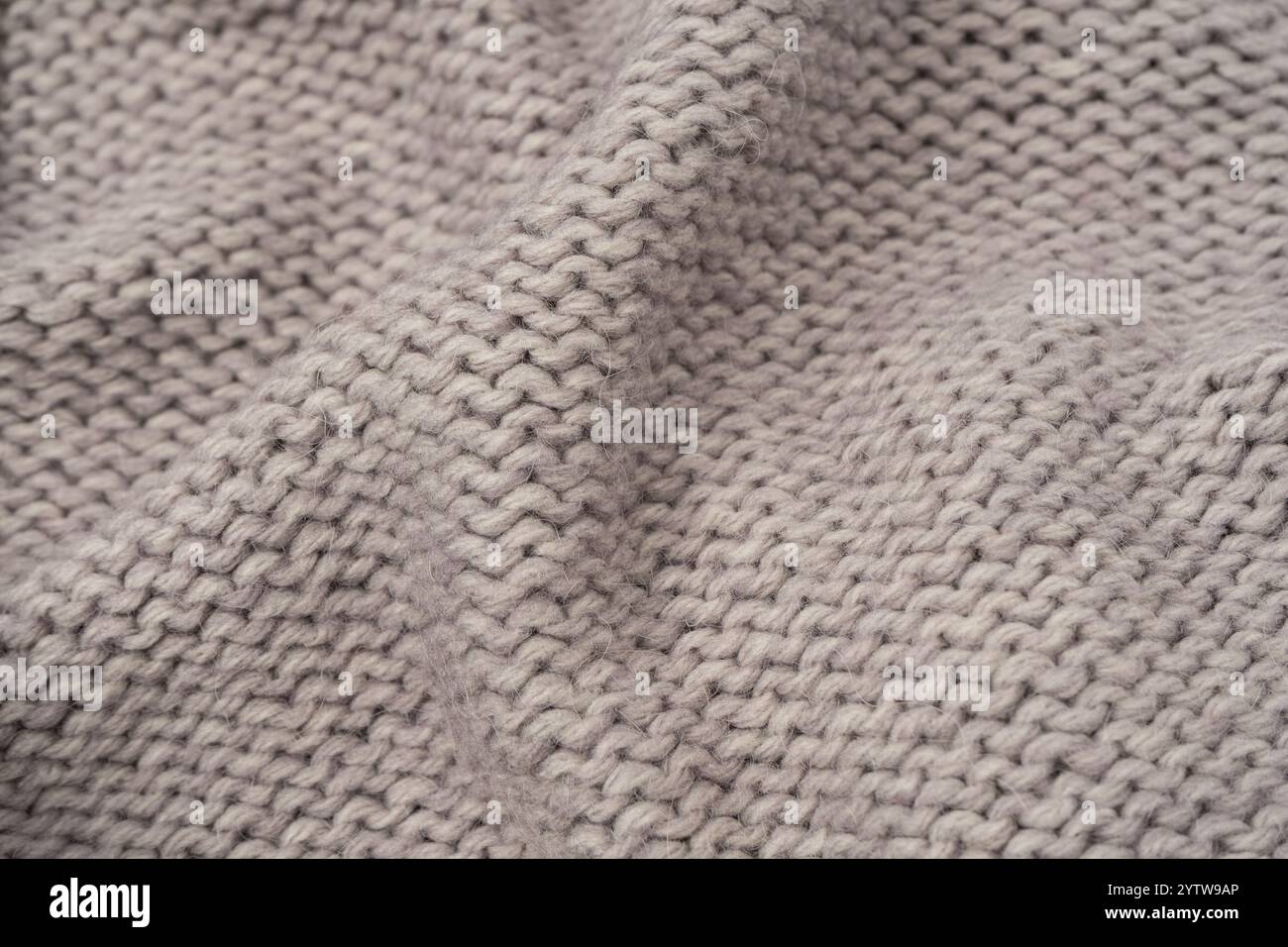 Grey wool sweater texture as a background. Top view. Stock Photo