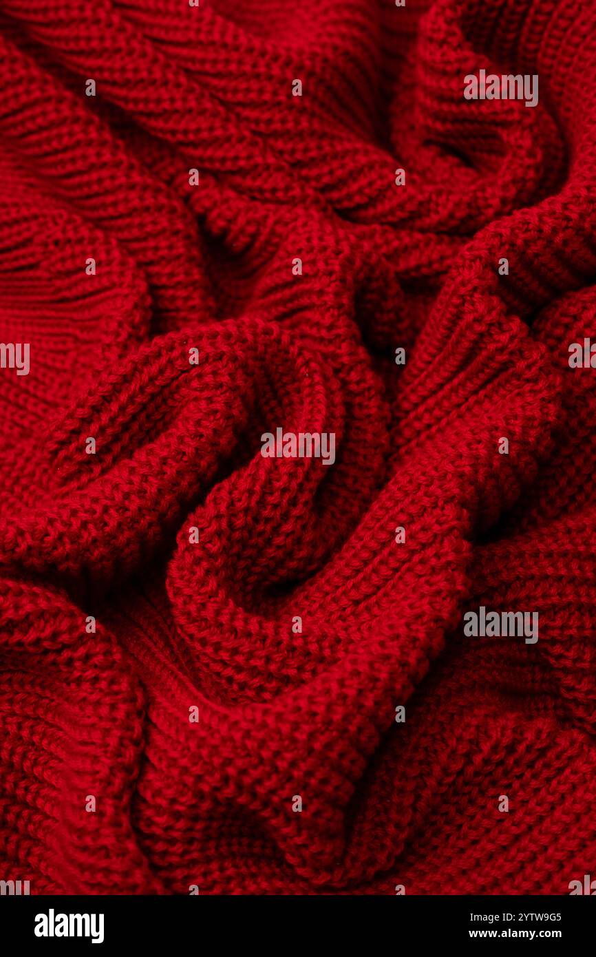 Red sweater texture as a background. Top view Stock Photo