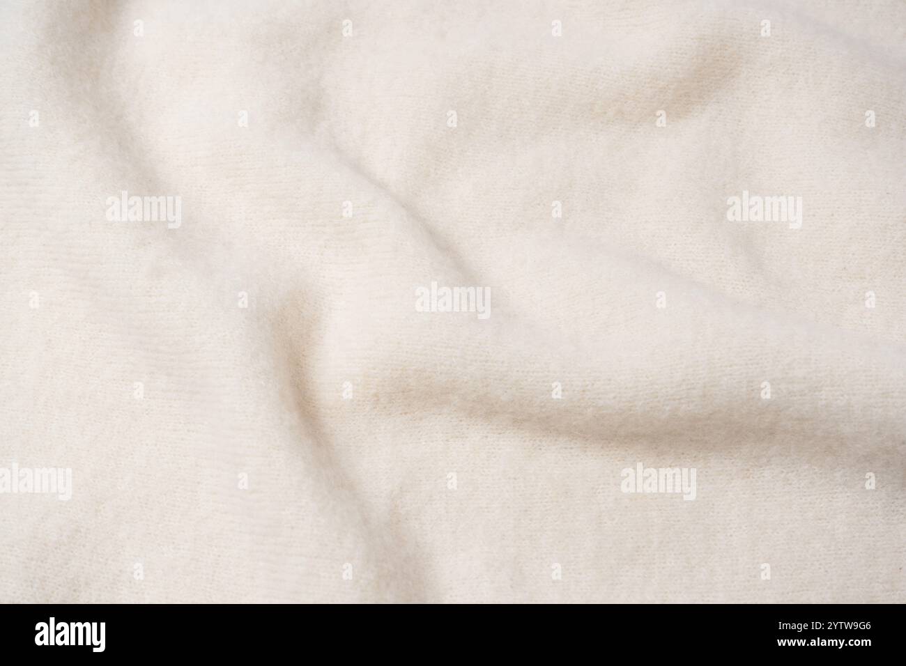 Beige sweater texture as a background. Top view. Stock Photo