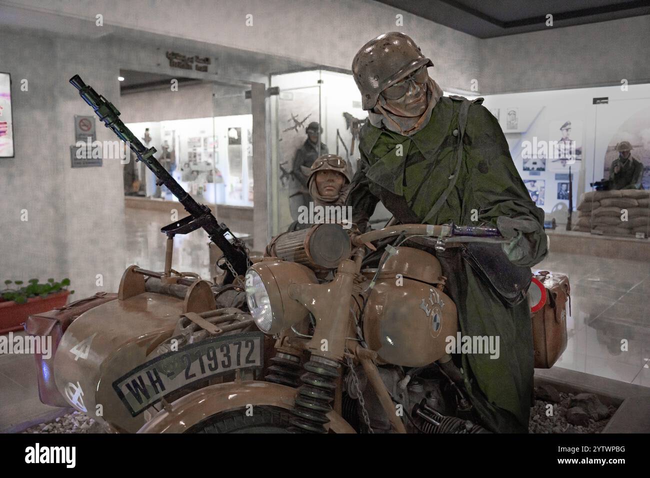 El Alamein Military Museum, Egypt: German WWII motorcycle and sidecar exhibit showcasing soldiers, weapons, and vehicles in the North Africa campaign Stock Photo