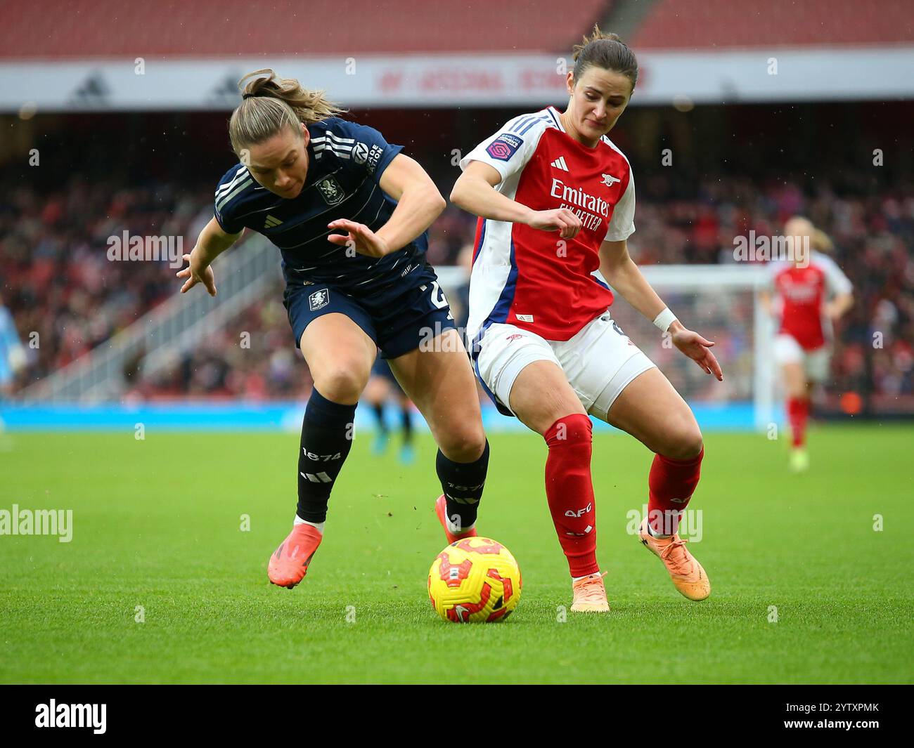 North London, United Kingdom. 8 December, 2024. Kirsty Hanson of Aston Villa and Emily Fox of Arsenal battle for the ball during the Barclays Women's Super League game between Arsenal and Aston Villa at the Emirates Stadium. Credit: Jay Patel/Alamy Live News Stock Photo