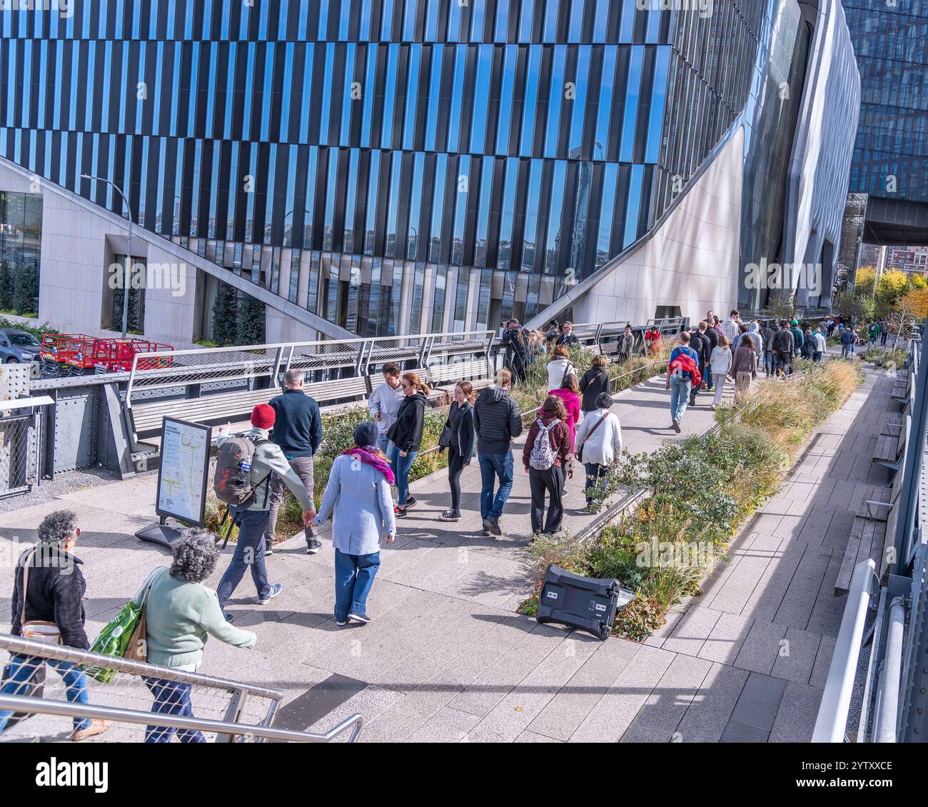 New York, New York, USA – October 26, 2024: Pedestrians walk along ...