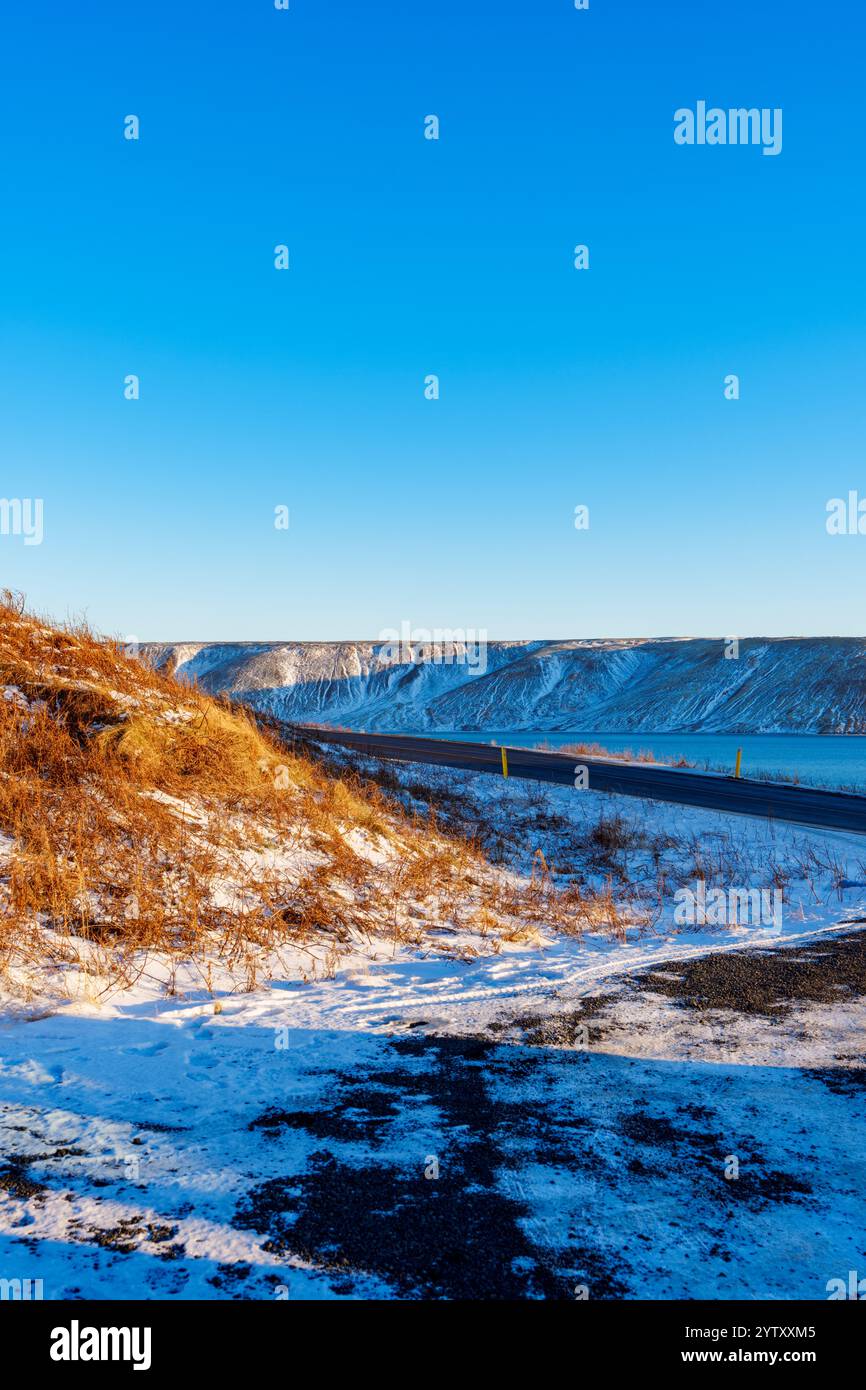 Iceland road through snowy mountain pass Stock Photo - Alamy