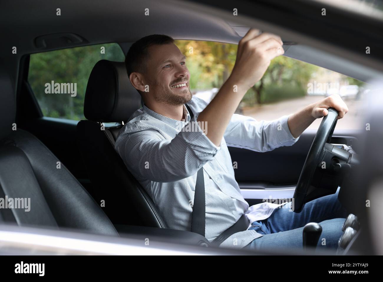 Man adjusting rear view mirror car hi-res stock photography and images ...