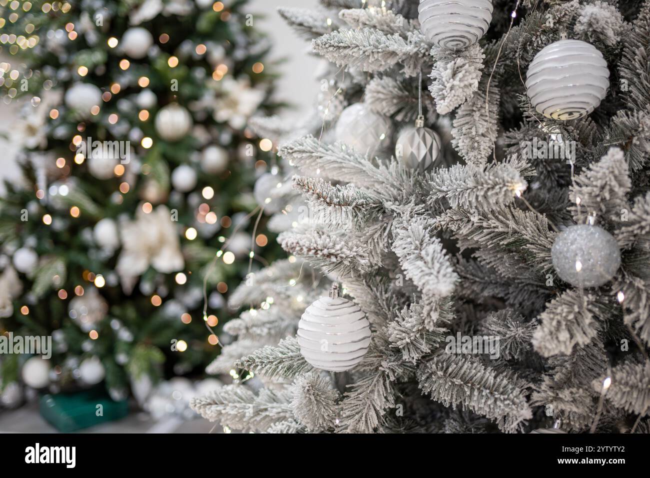 Christmas tree with silver toys. Festively decorated Christmas tree ...