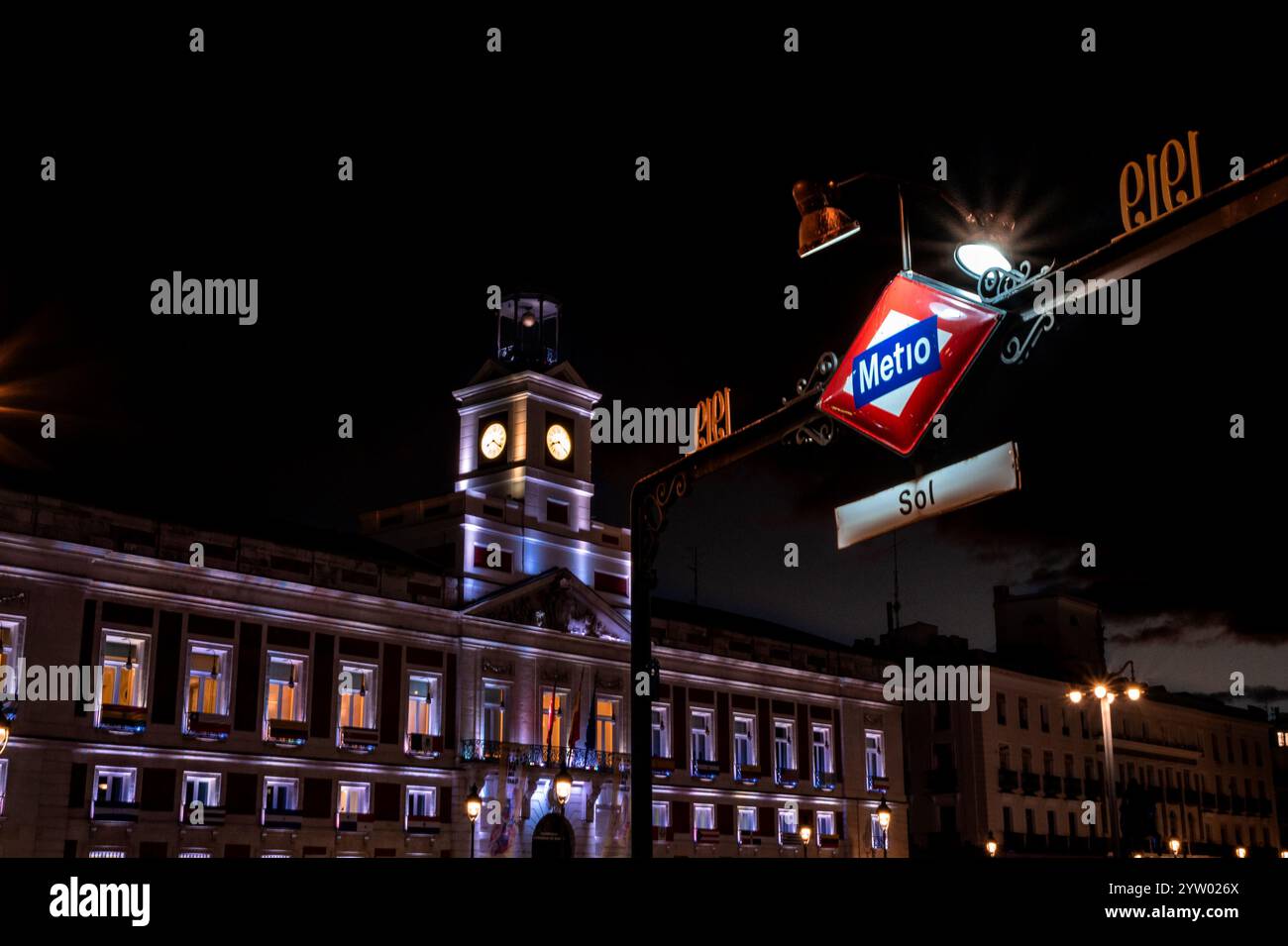 A large building with a clock tower and a sign that says Metro. The ...