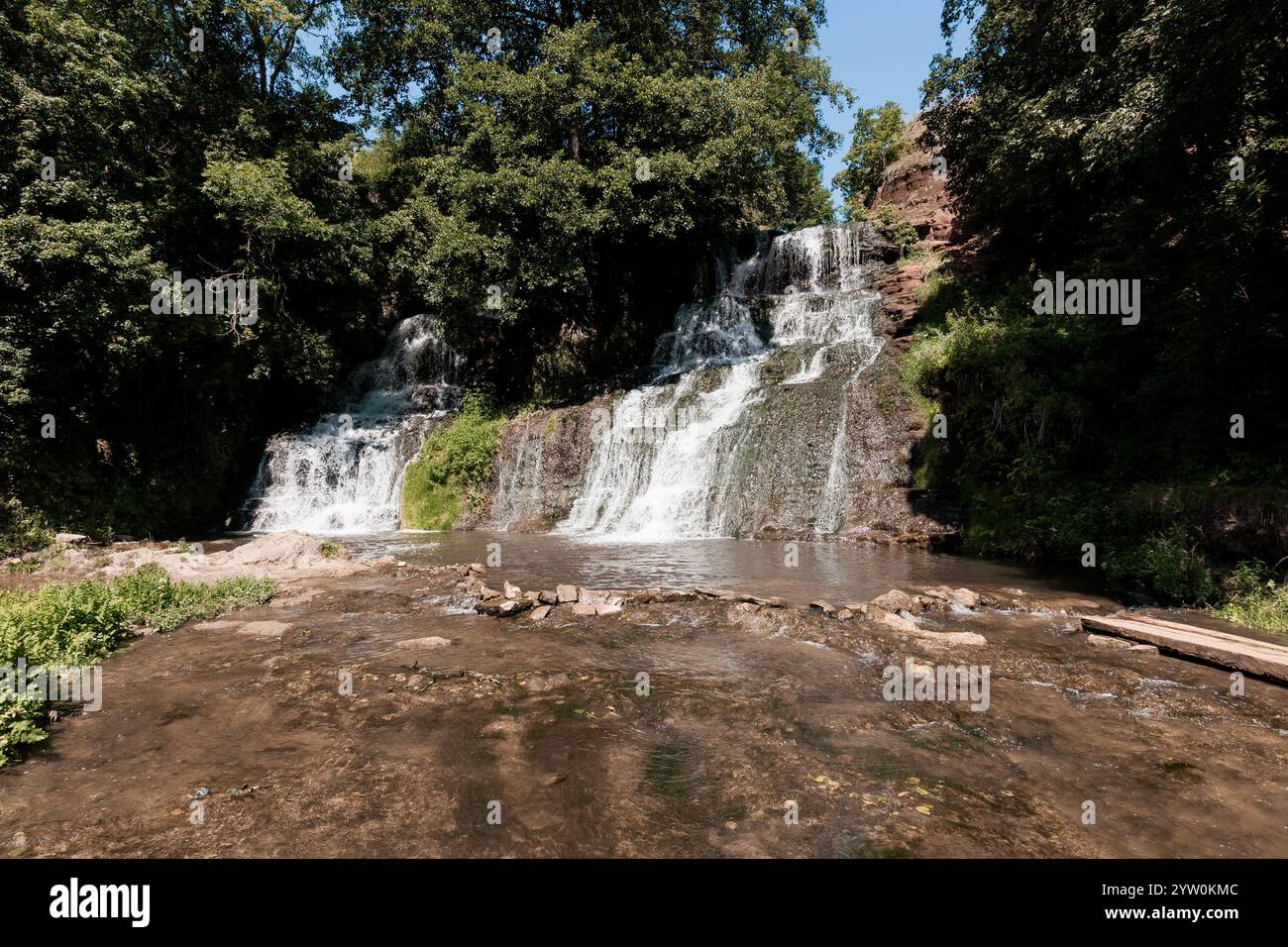Serene waterfall cascading through lush hi-res stock photography and ...