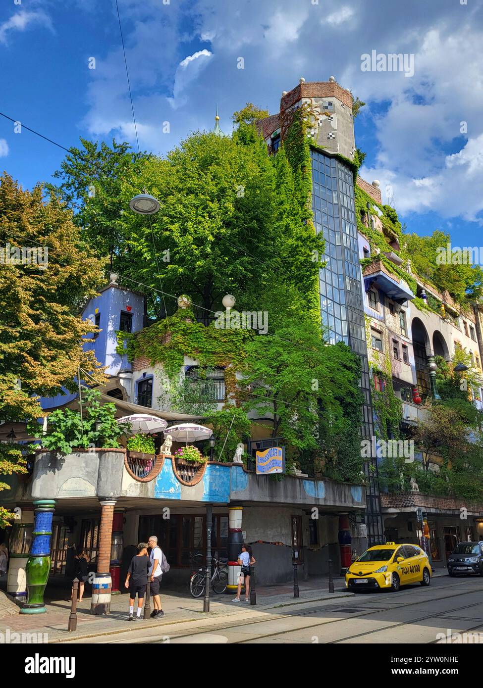 Green Urban Architecture with Lush Foliage and Modern Design Elements - Smartphone Captured Stock Image