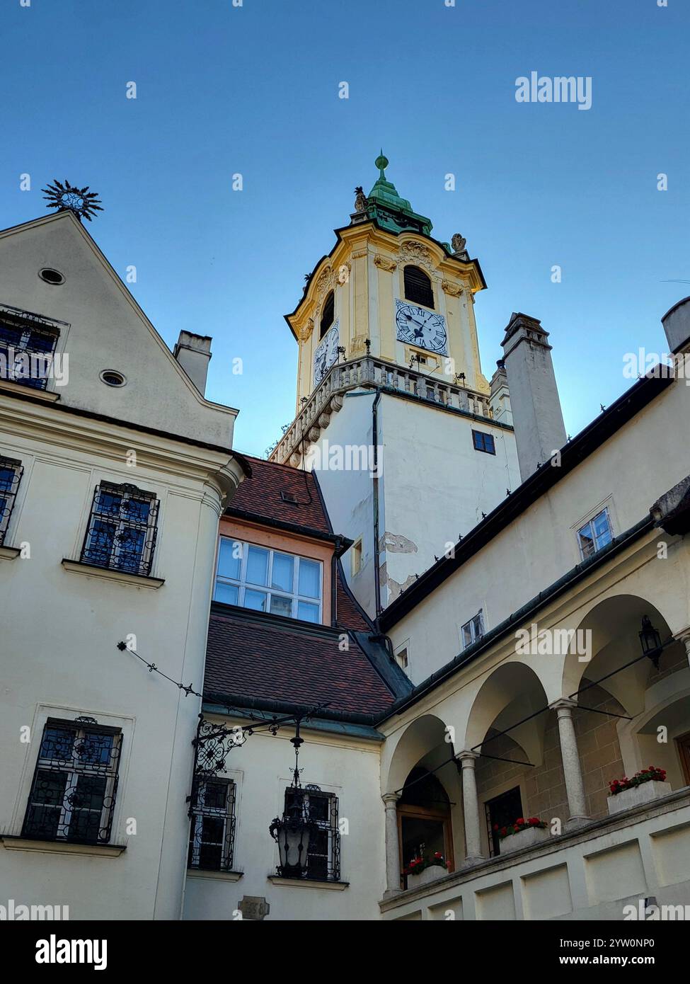 Historic Clock Tower Against Clear Blue Sky in Architectural Setting - Smartphone Captured Stock Image