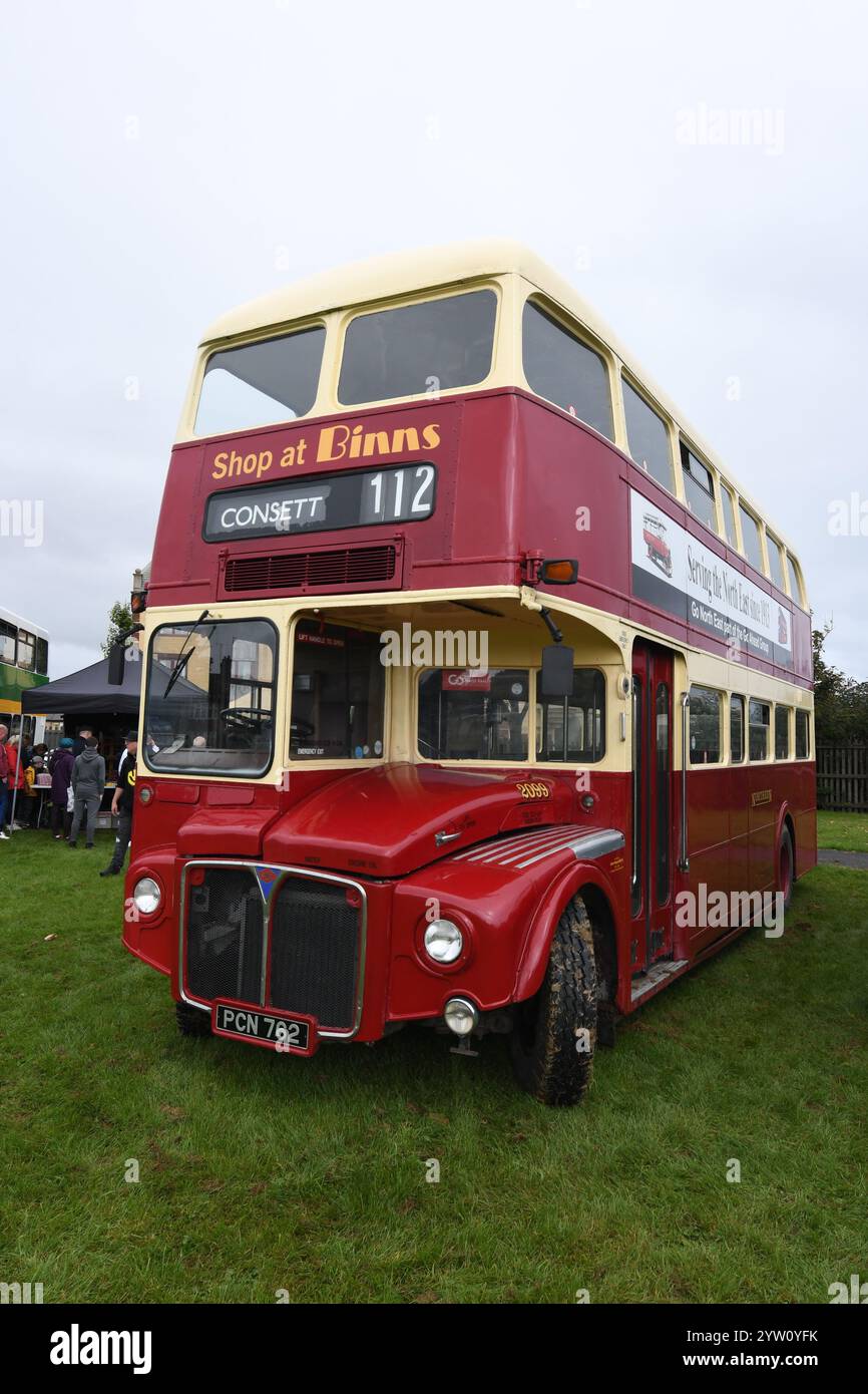 A red and cream liveried Routemaster bus, route number 112, destination Consett, with a classic Shop at Binns advert on the front Stock Photo