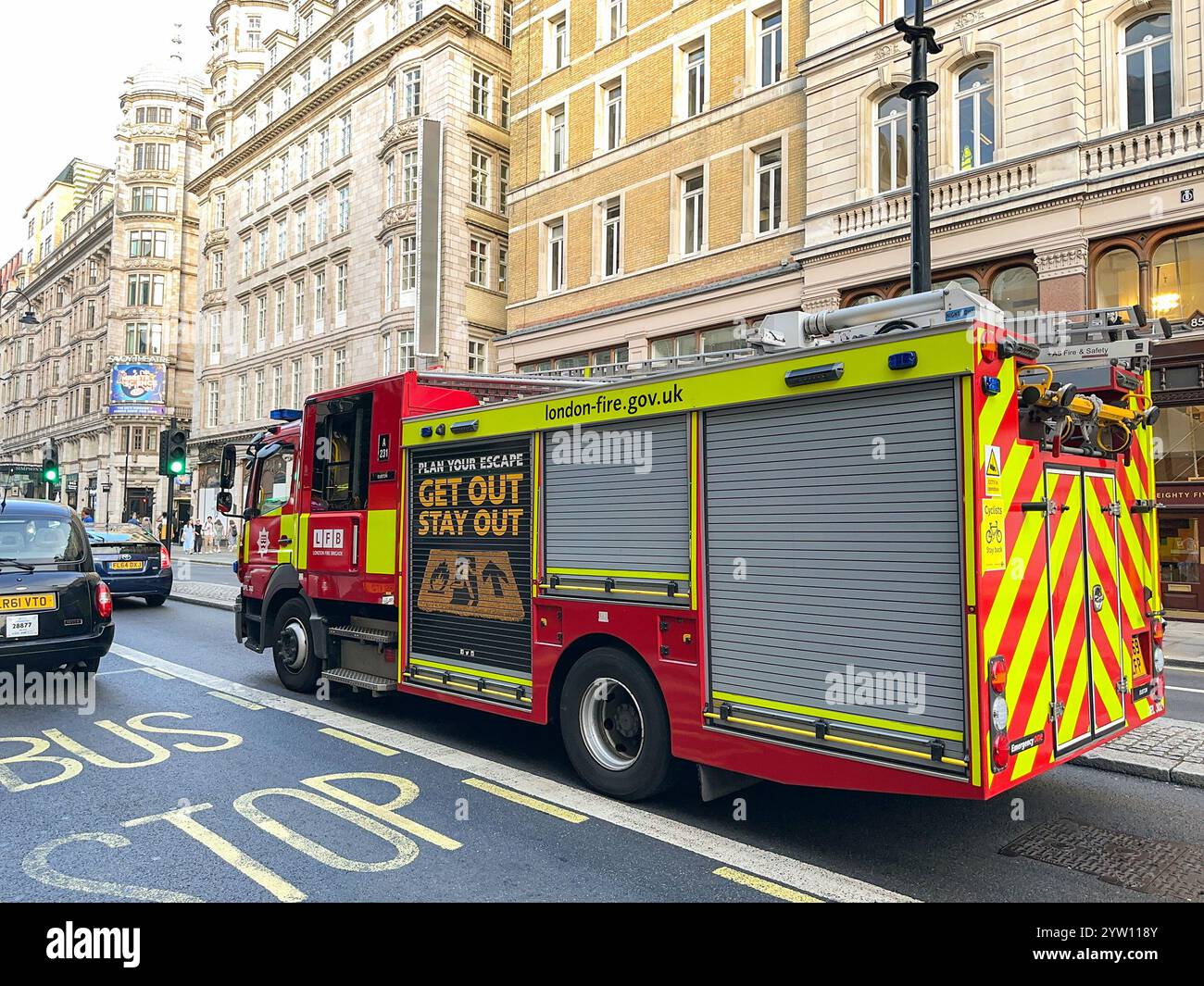 London, England, UK - 24 August 2023: Fire engine of the London Fire Service driving on a street in central London. - Smartphone Captured Stock Image
