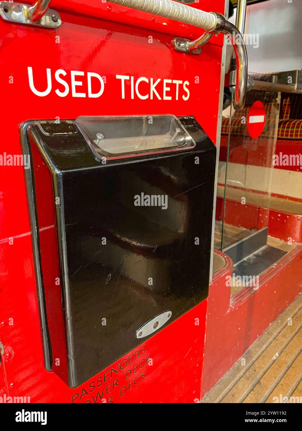 London, England, UK - 23 August 2023: Close up view of a bin for used tickets on a vintage bus - Smartphone Captured Stock Image