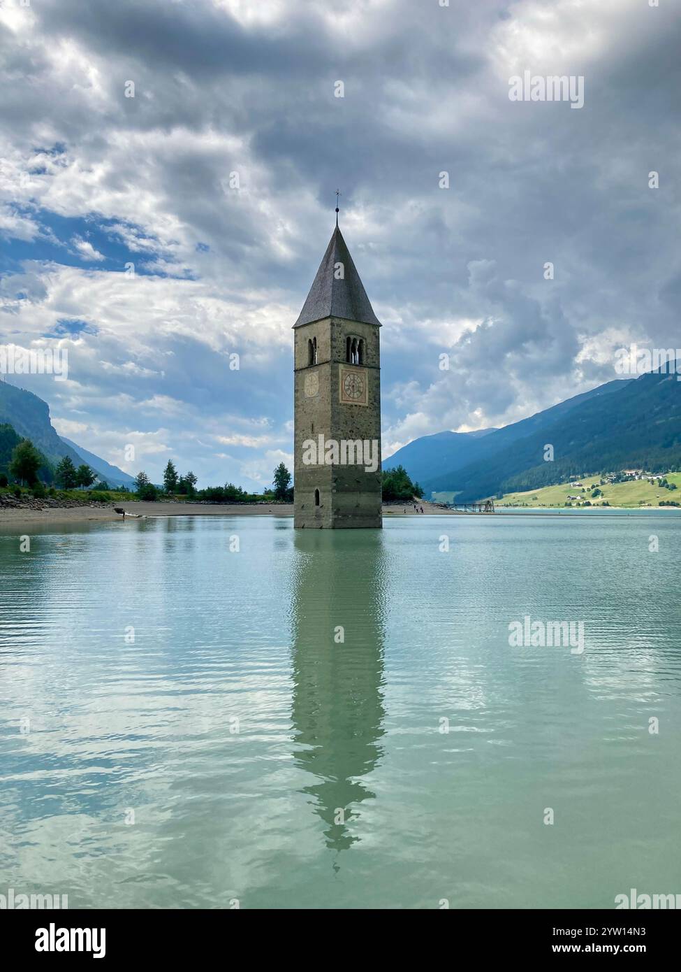 The steeple of a sunken church in Lago di Resia Stock Photo