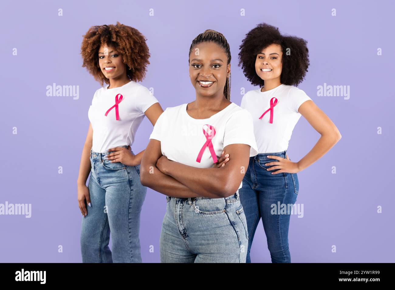Empowered women supporting each other with pink ribbons in friendship ...