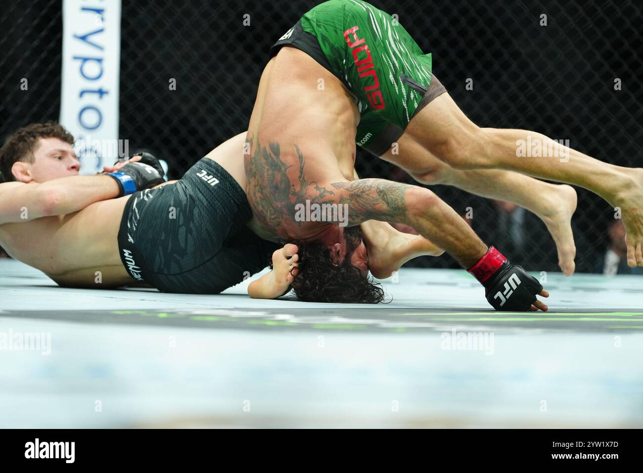 LAS VEGAS, NV -DECEMBER 7:Clay Guida and Chase Hooper meet in the octagon for a 3-round bout during UFC310 - Pantoja vs Asakura at T-Mobile Arena on December 7, 2024 in Las Vegas, Nevada (Photo by Louis Grasse/PxImages) Stock Photo