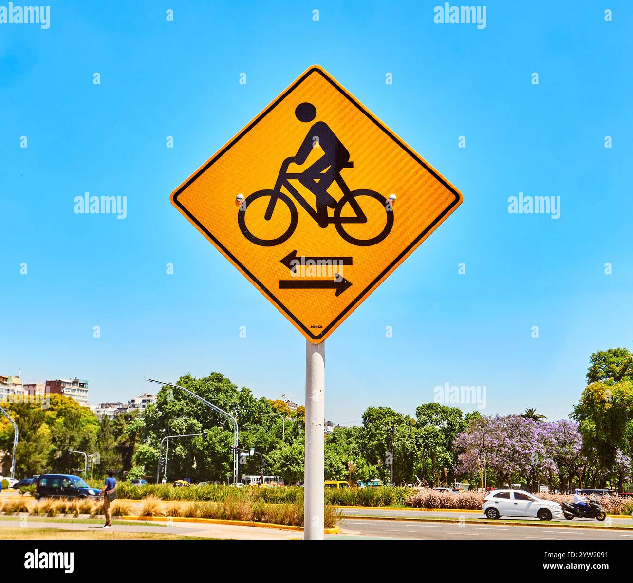 Bicycle lane sign against blue sky background with street view Stock ...