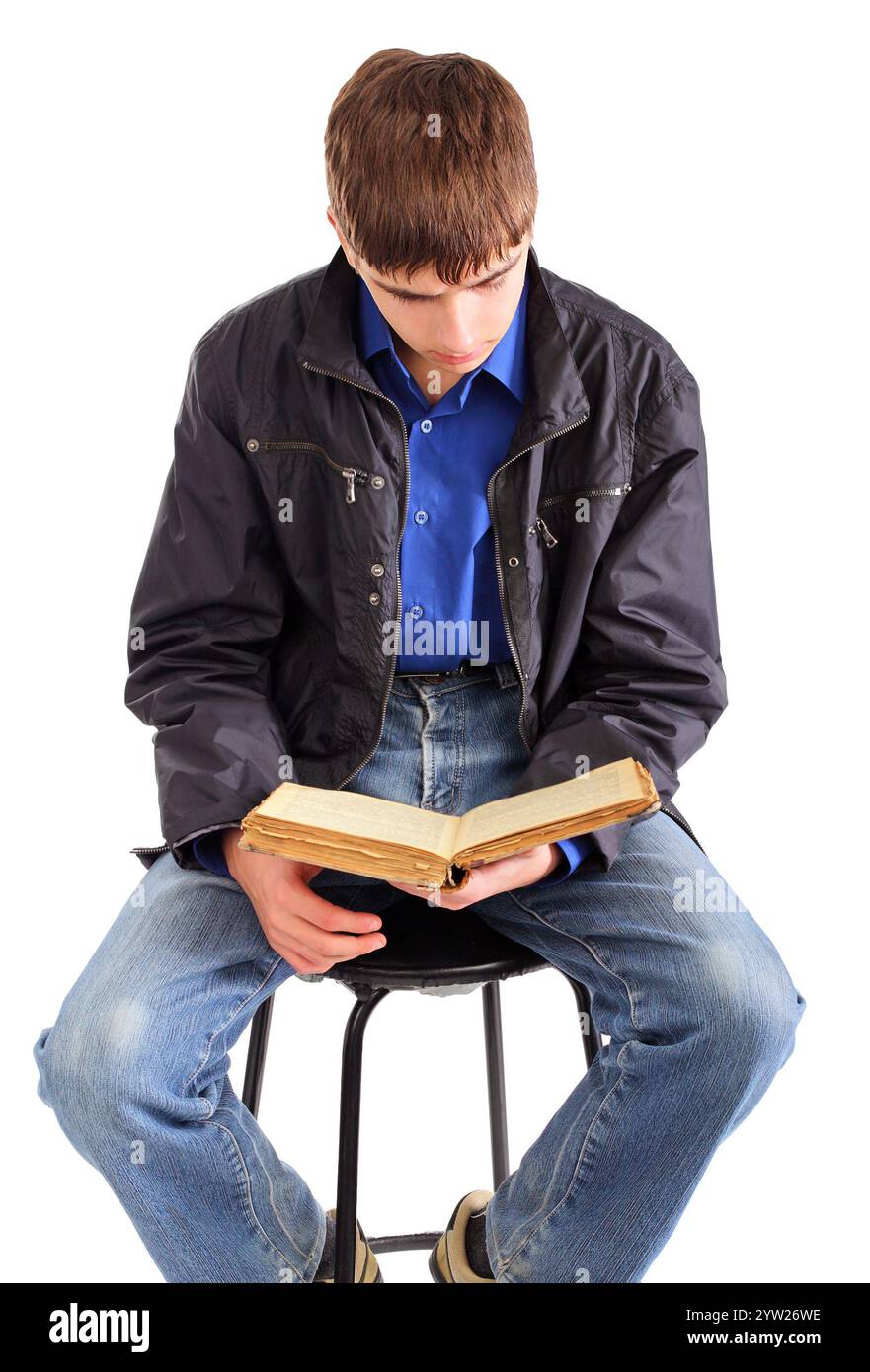 teenager reads old book isolated on the white background Stock Photo ...