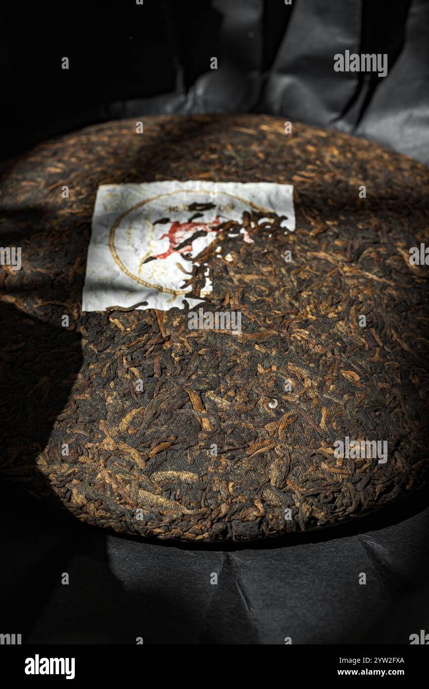 This text details a beautifully compressed tea cake, highlighting its ...