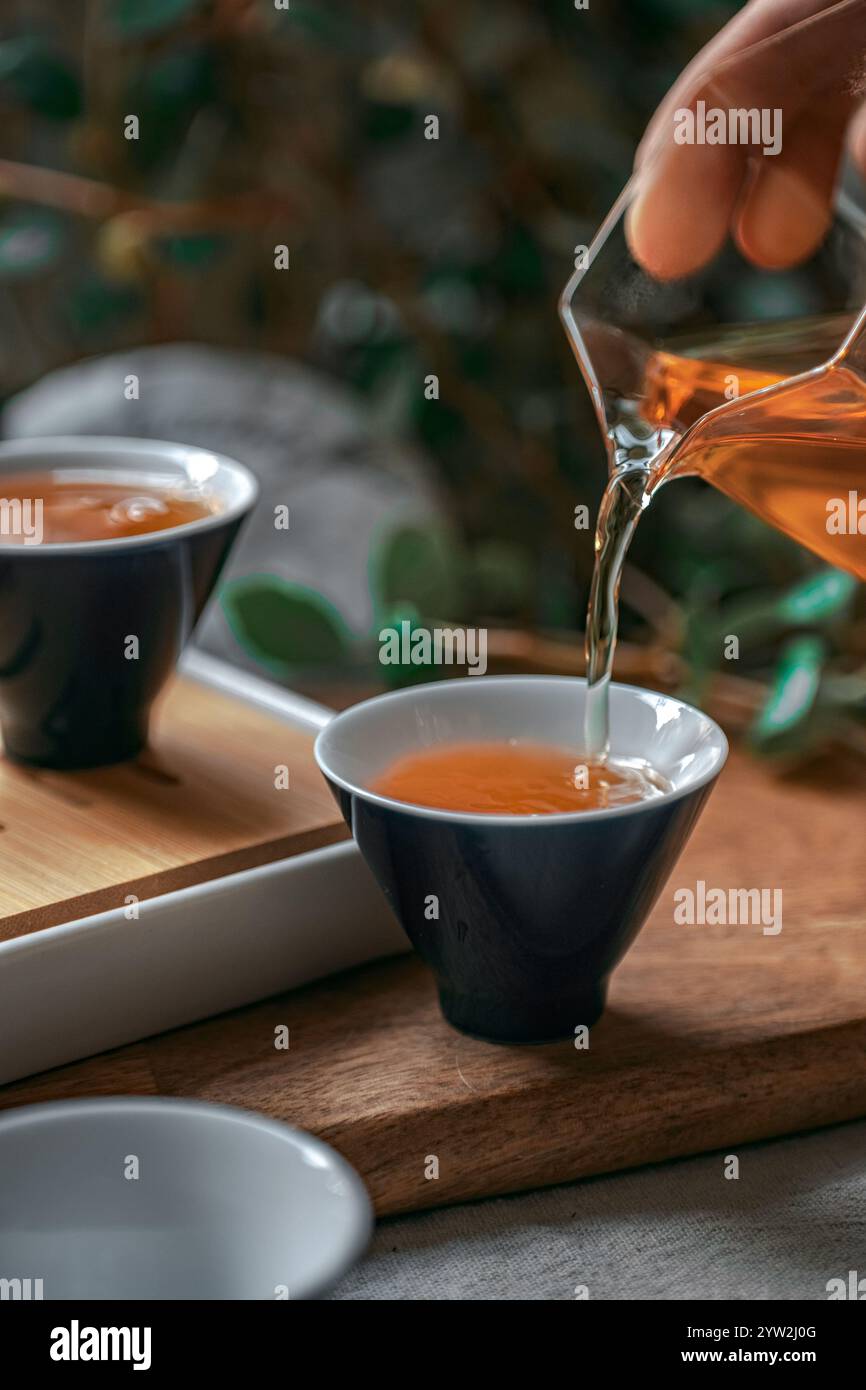 Making Tea Scenes Serene scene depicting gathering hi-res stock photography and images ...