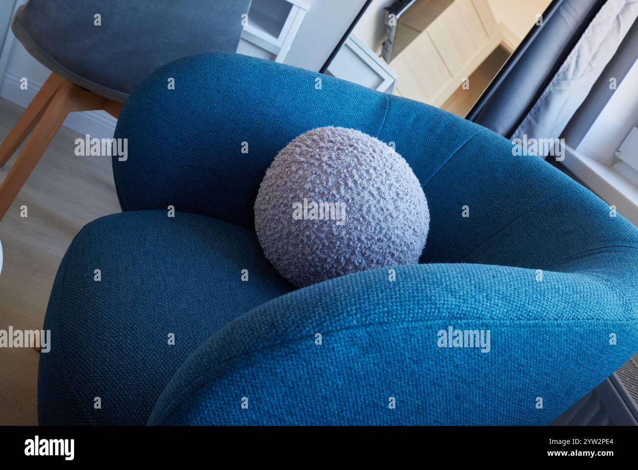 A Modern Armchair Featuring a Cozy Circular Cushion Set in a ...