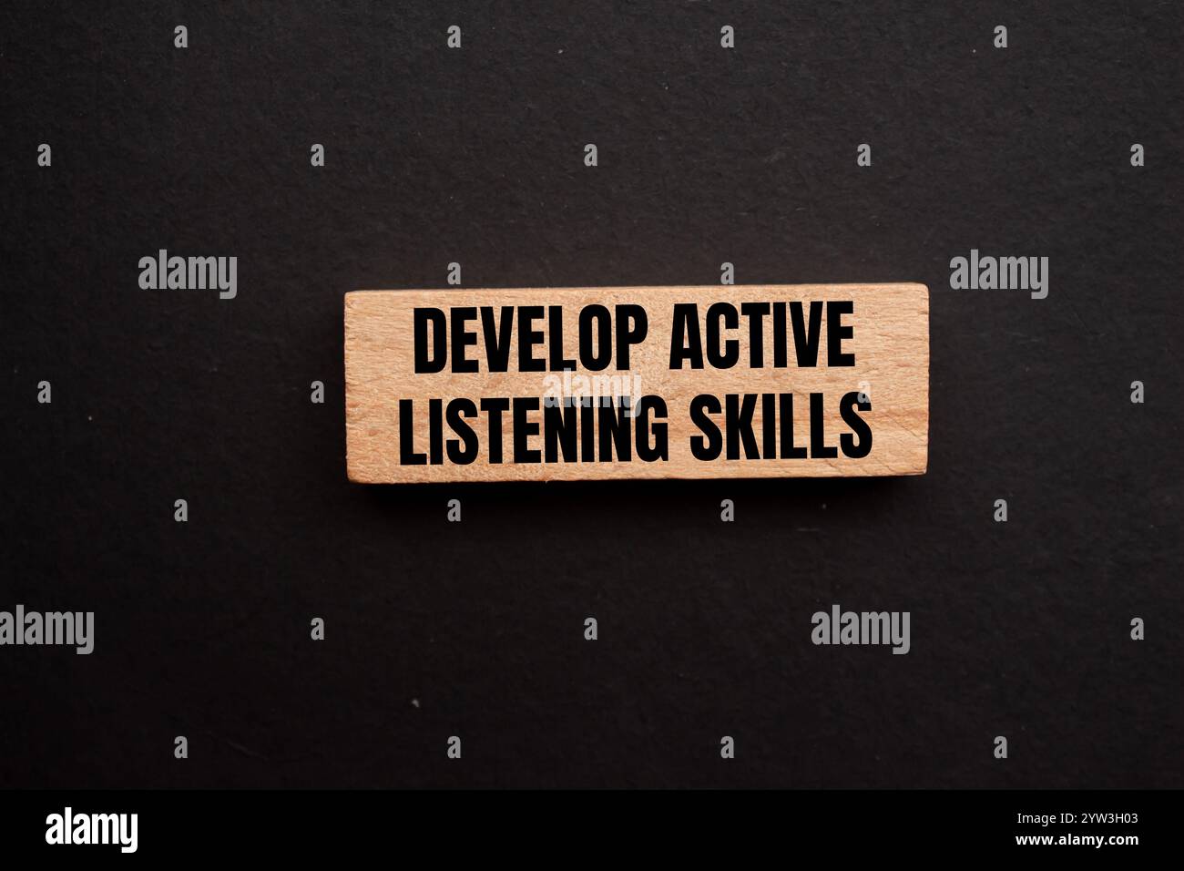 Develop active listening skills message written on wooden block with ...
