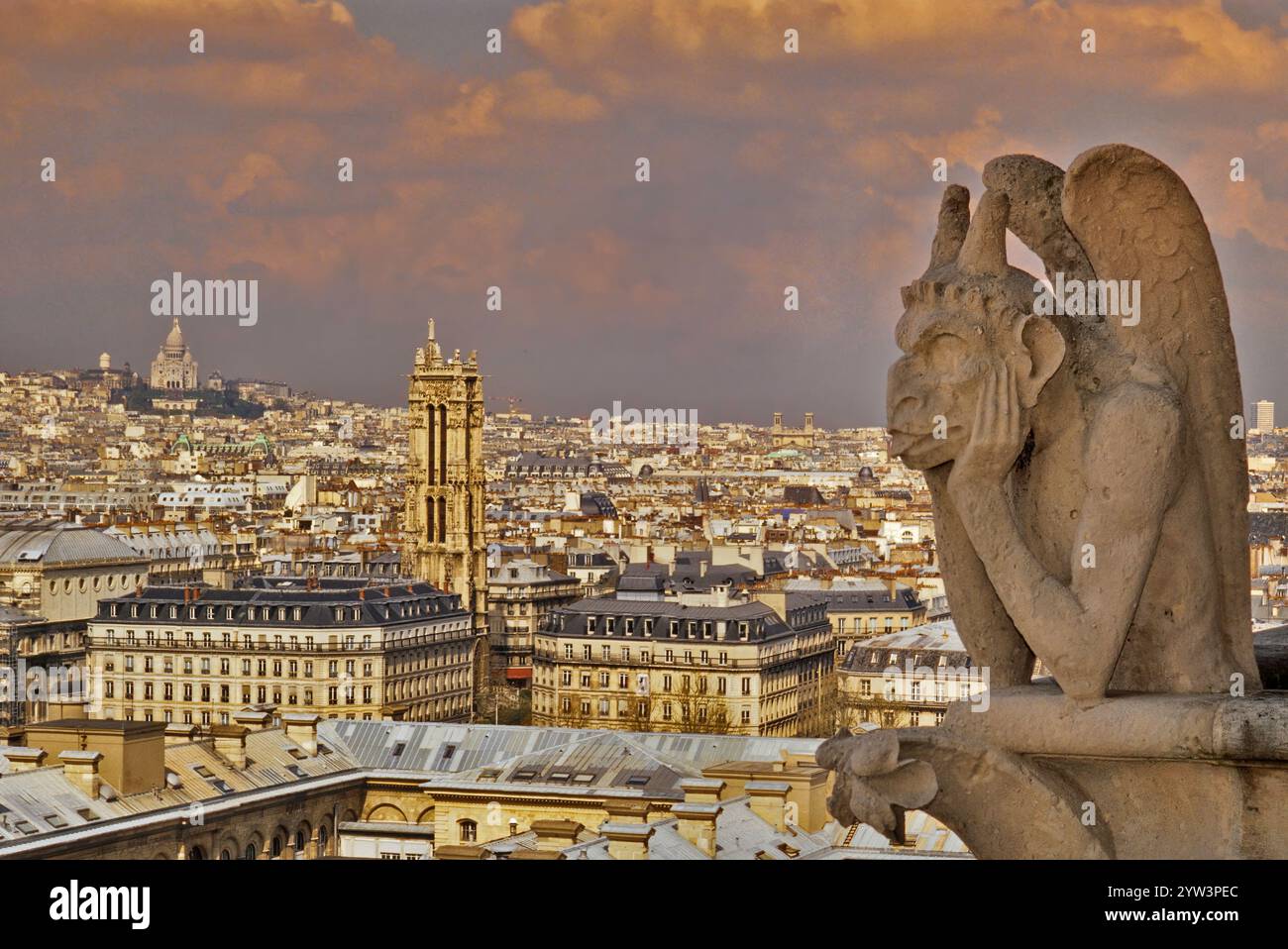 Le Stryge, strix on west facade at Notre Dame Cathedral, before 2019 fire, view of city, Sacre-Coeur in distance, Paris, France Stock Photo