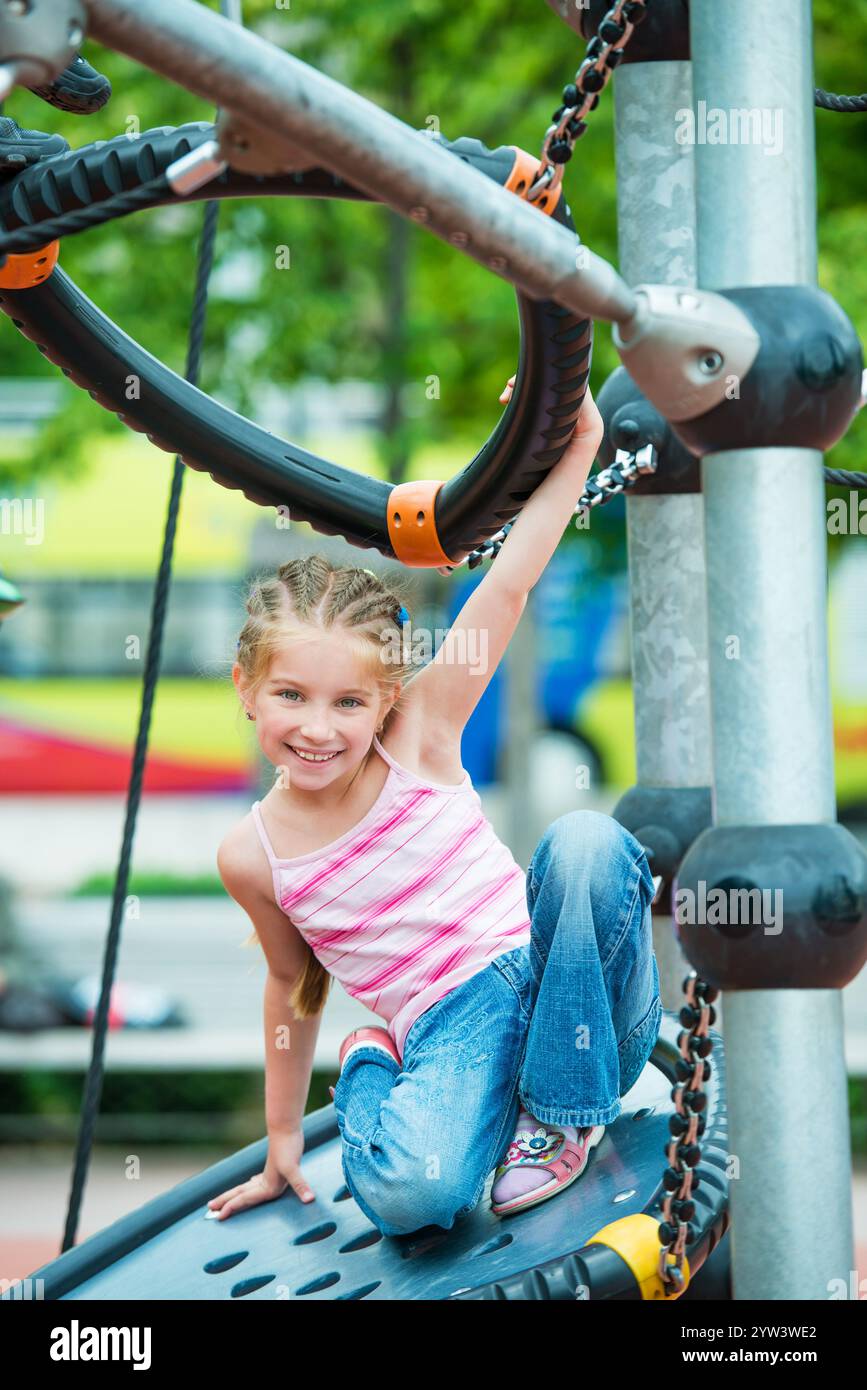 cute beautiful smiling little girl on a playground Stock Photo - Alamy