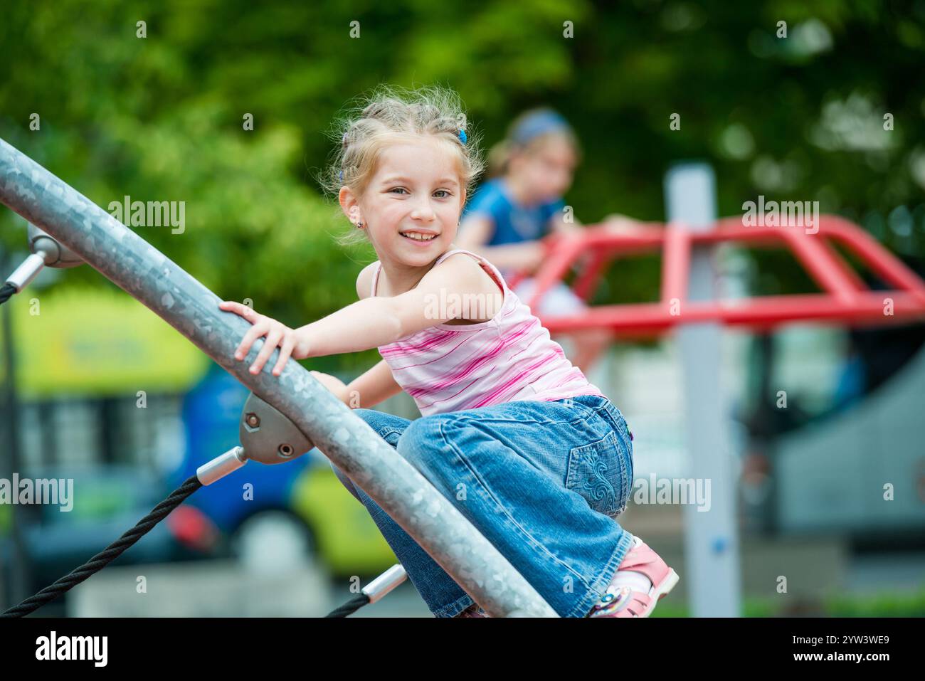 cute beautiful smiling little girl on a playground Stock Photo - Alamy