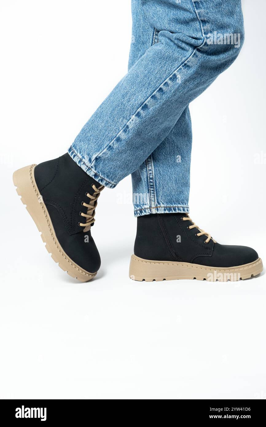 High boots, trendy winter shoes, isolate close-up place for text. Stock Photo