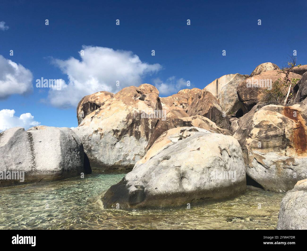 Rock formation on the coast in crystal clear water. Tortola BVI - Smartphone Captured Stock Image