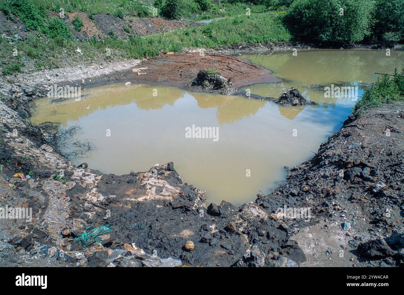 Legacy of polluting industries: metal processing factory waste tip, 1994 Stock Photo