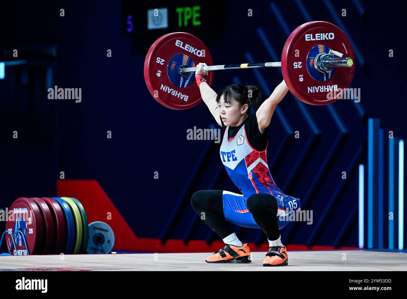 Zi-You Hong of Chinese Taipei competes in snatch, 45 kg women category during the 2024 IWF World Championships at the IWF Arena in Manama, Bahrain, December 06, 2024. Stock Photo