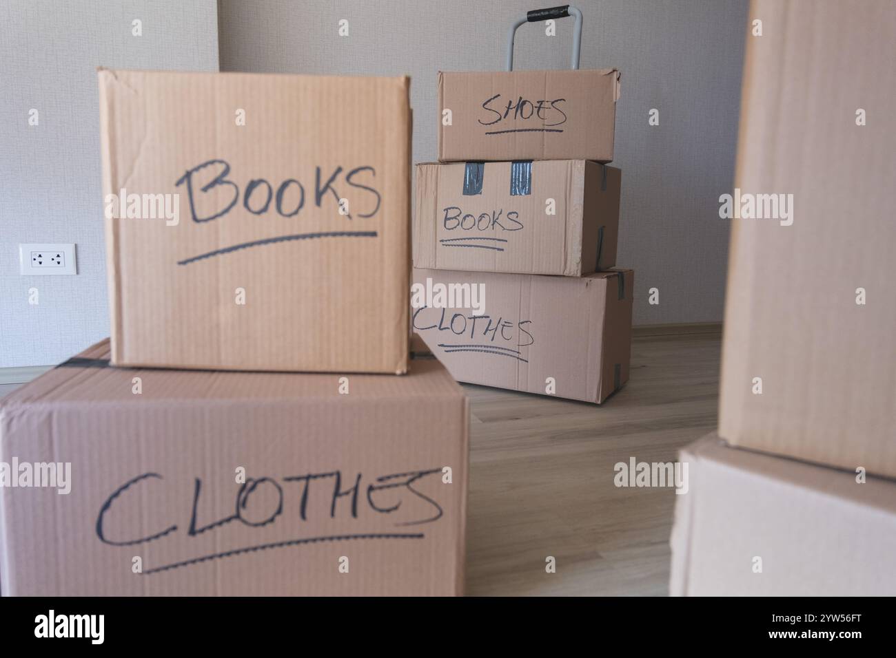 Cardboard boxes with books and clothes hi-res stock photography and ...