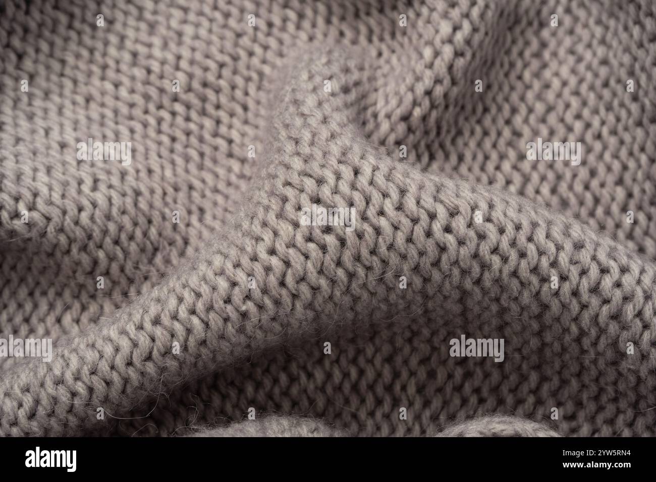 Grey wool sweater texture as a background. Top view. Stock Photo