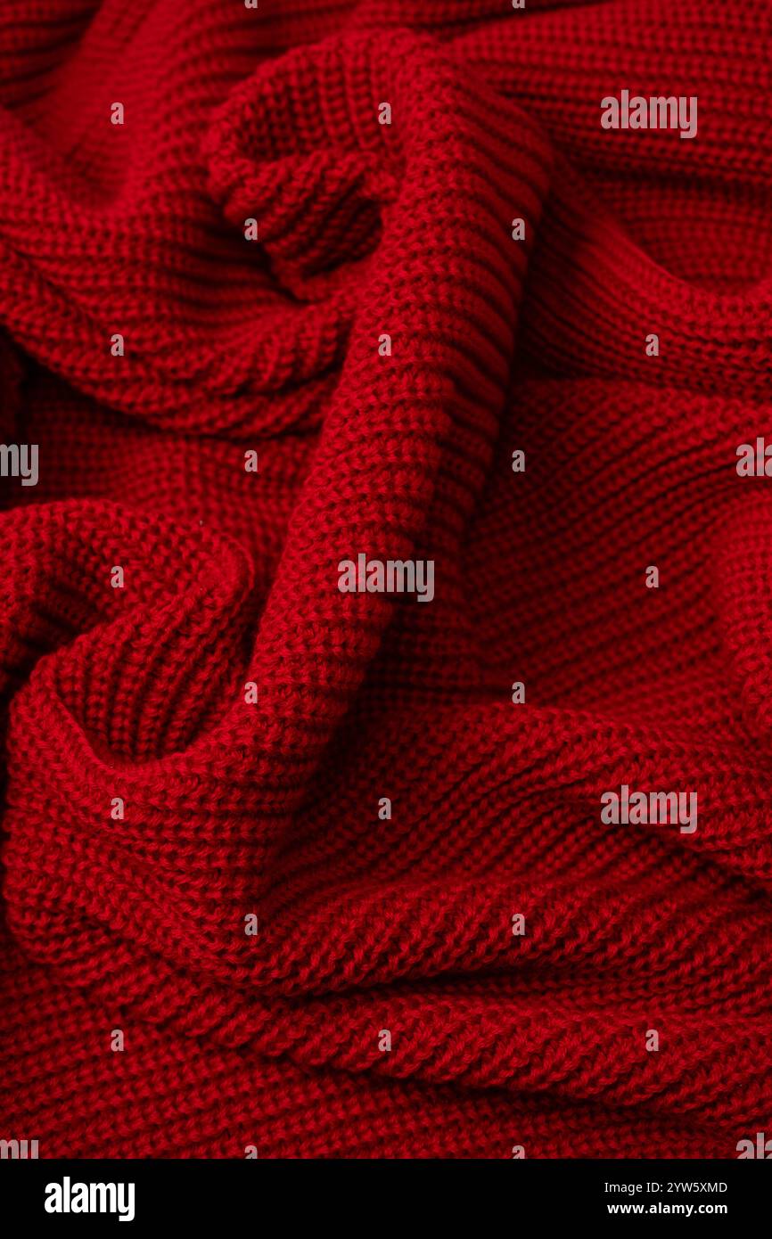 Red sweater texture as a background. Top view Stock Photo
