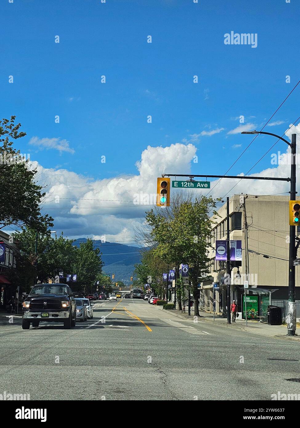 Sunny day vibes. A perfect blend of urban charm and scenic mountain views. - Smartphone Captured Stock Image