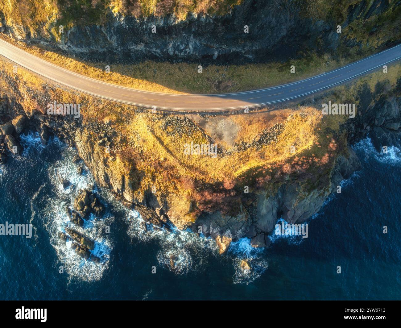 Aerial view of winding coastal road, cliffs and sea with waves Stock ...