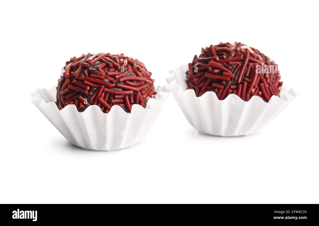 Delicious chocolate truffles in paper cups on white background Stock ...