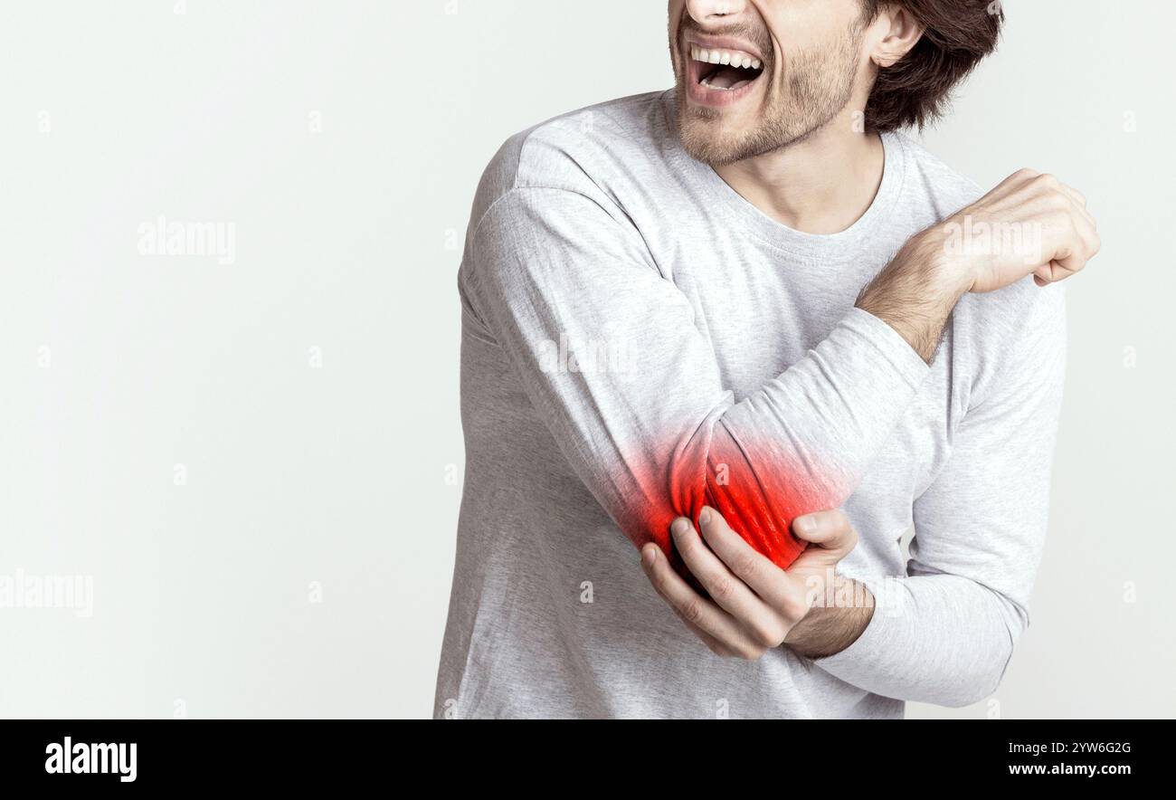 Injury Concept Man Screams In Pain At Elbow Stock Photo Alamy injury-concept-man-screams-in-pain-at-elbow-stock-photo-alamy
