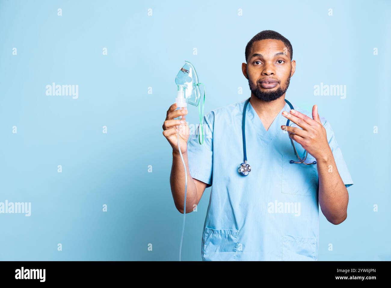 African american nurse presenting medical inhaler to help with aerosols ...