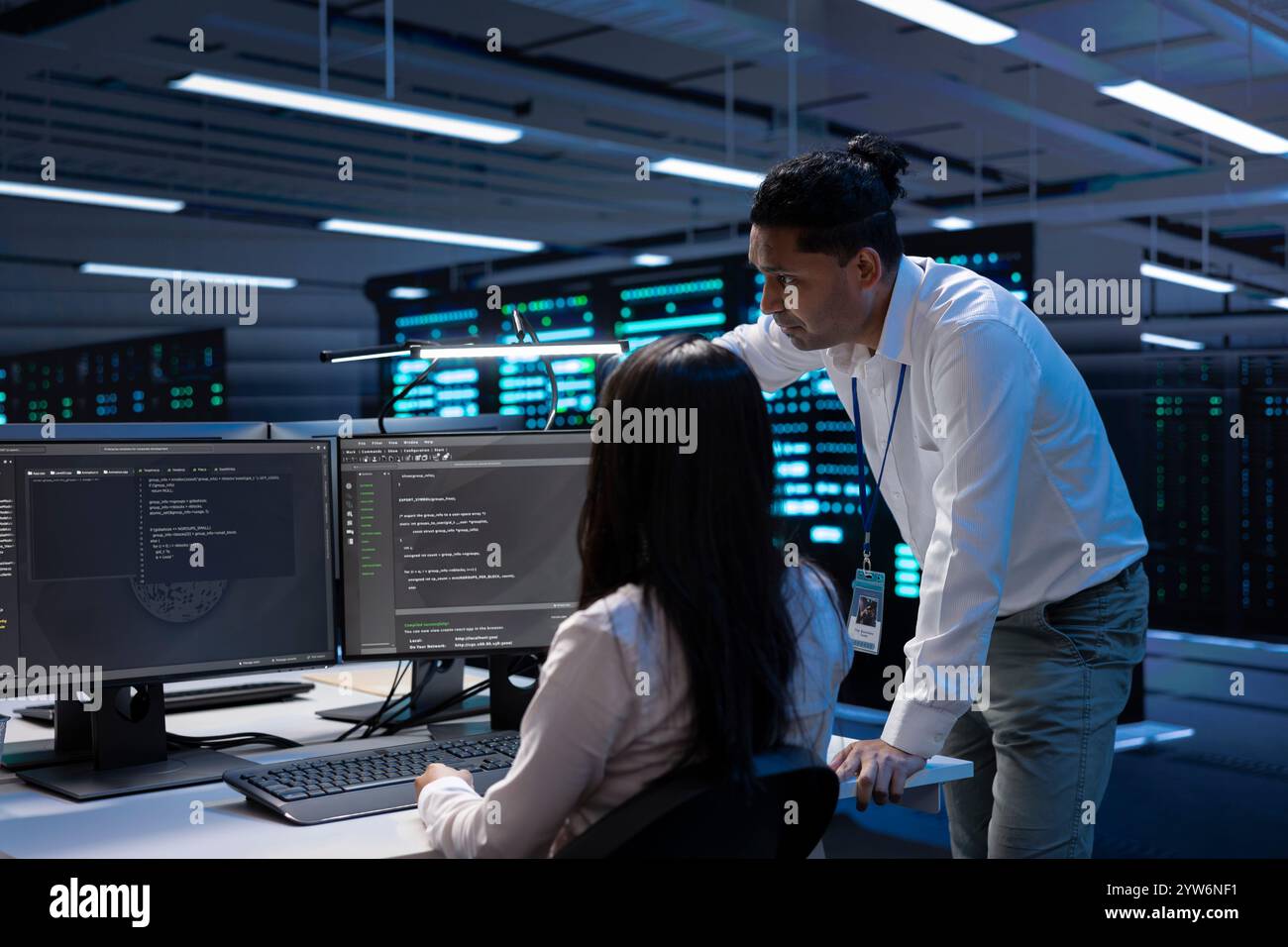 System administrators in data center running system diagnostic tests on PC to fix problems. IT experts deploying and error checking utilities on computers to repair network issues in server rigs Stock Photo