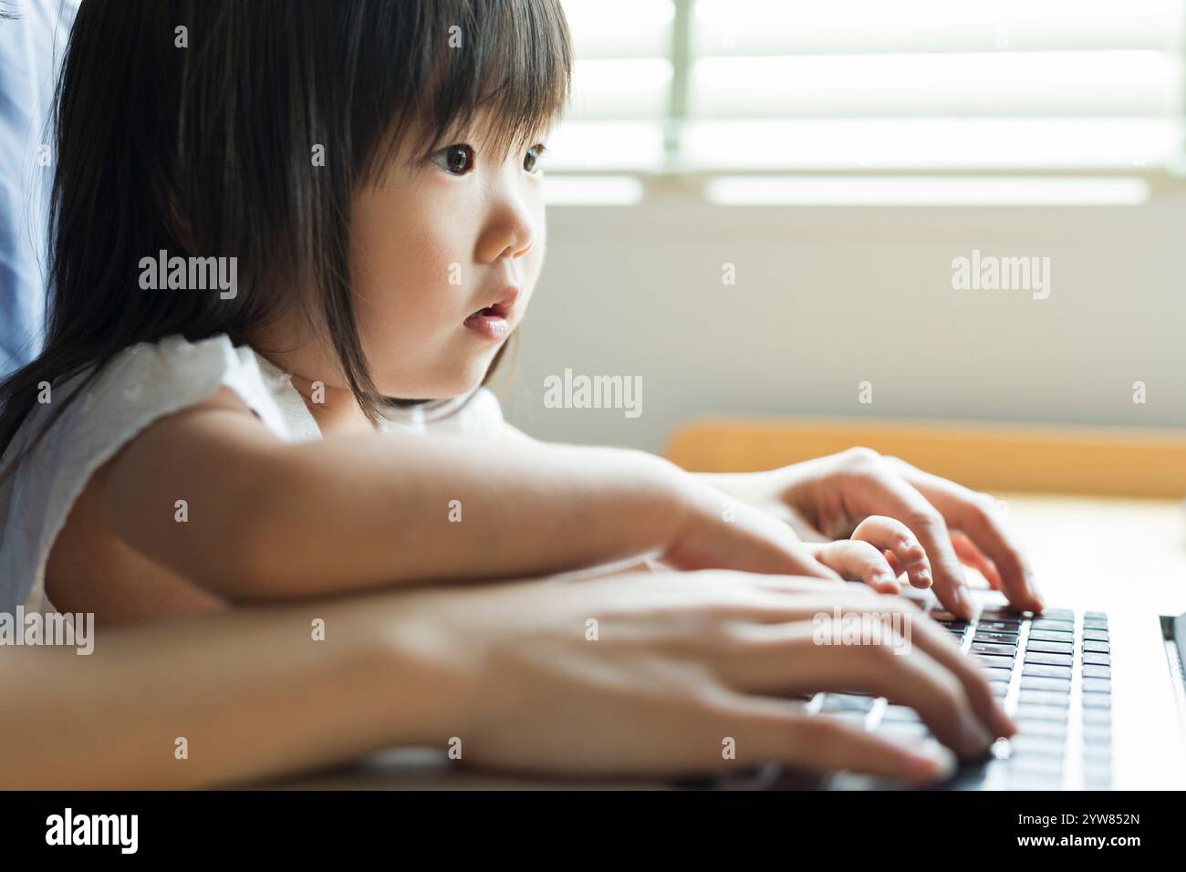 Child working computer hi-res stock photography and images - Alamy