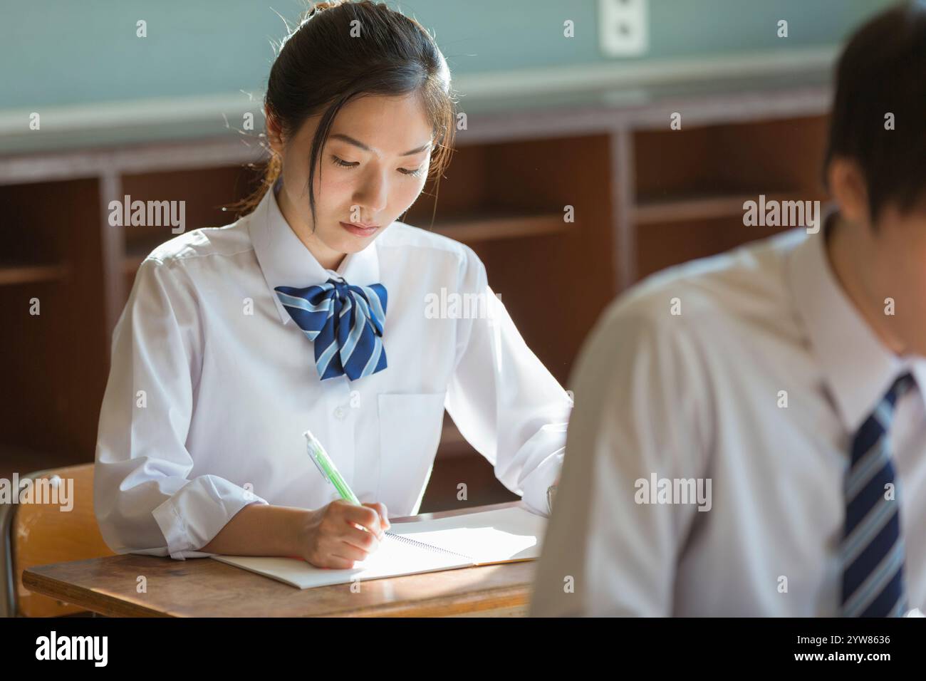 High school girls studying in a classroom Stock Photo - Alamy