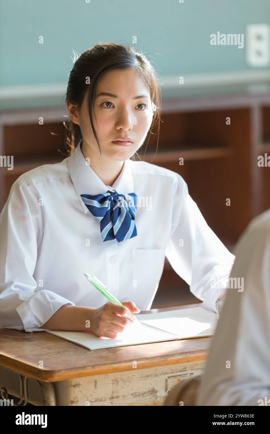 High school girls studying in a classroom Stock Photo - Alamy