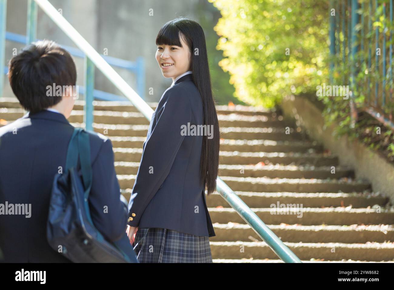 High school boys and high school girls on their way to school Stock ...