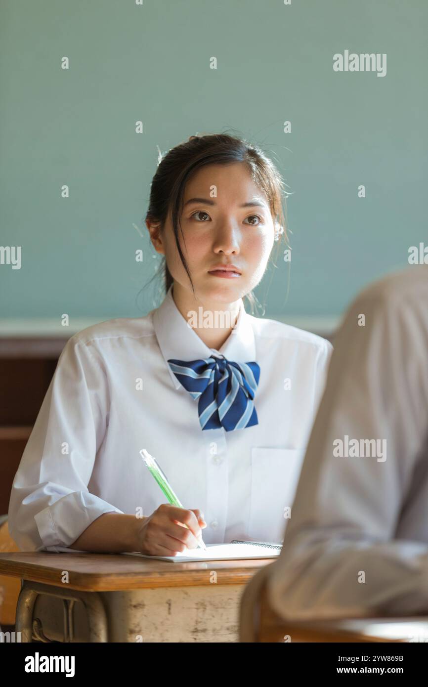 High school girls studying in a classroom Stock Photo - Alamy