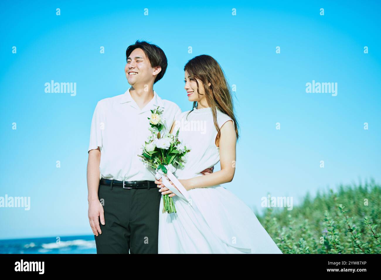 Wedding Couple Blue Sky Stock Photo - Alamy